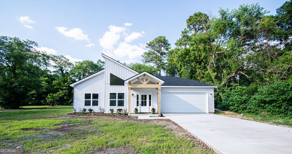 117 Mc Elmurray Drive Augusta, GA 30901 - Photo 1 of 1 a front view of a house with a garden and trees