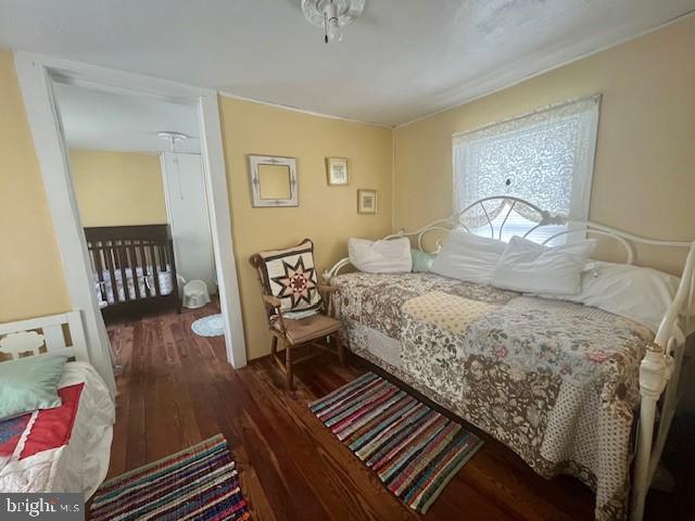 1903 Honeyville Road Stanley, VA 22851 - Photo 13 of 23 a bedroom with a bed and wooden floor