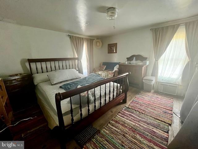 1903 Honeyville Road Stanley, VA 22851 - Photo 15 of 23 a bedroom with a bed and wooden floor