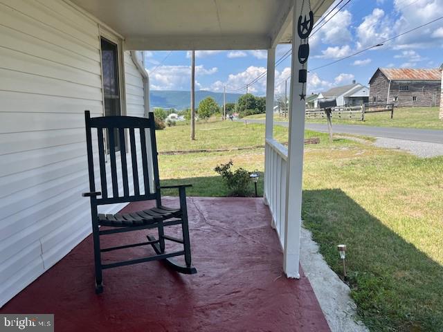 1903 Honeyville Road Stanley, VA 22851 - Photo 19 of 23 a view of a patio with a table chairs and a floor to ceiling window