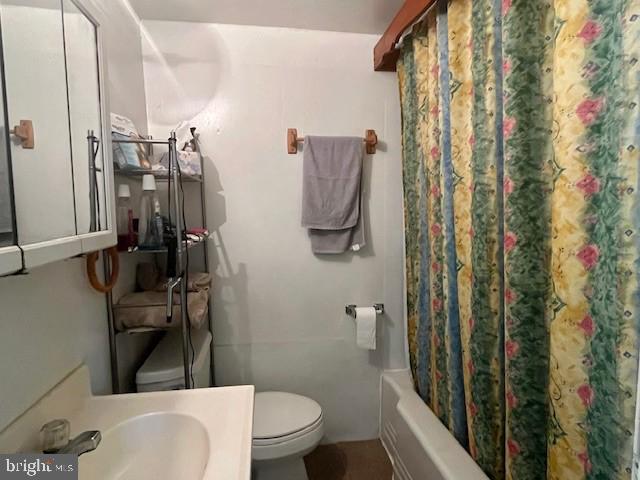 1903 Honeyville Road Stanley, VA 22851 - Photo 10 of 23 a bathroom with a toilet sink and shower curtain
