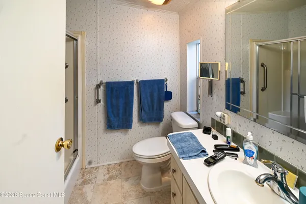 a view of a dining room with furniture and window
