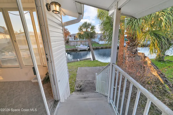 a view of balcony with furniture