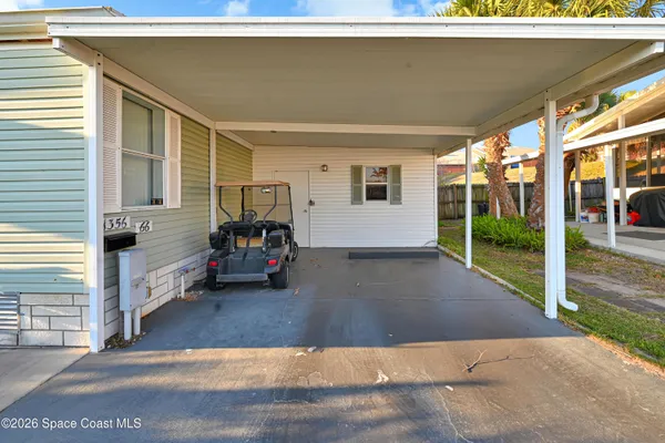 an aerial view of a houses with outdoor space