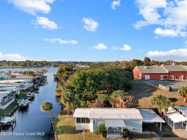 a room with pool table windows and outdoor view