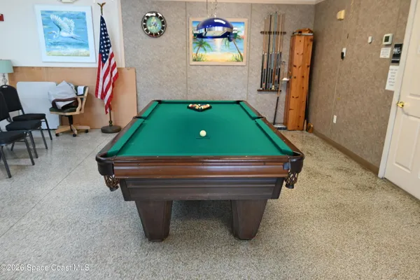 a view of a lake with a garden and a table