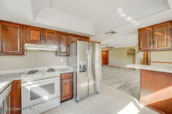 a view of a kitchen with a fridge