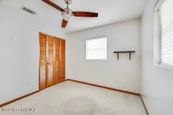 a bathroom with a sink toilet and mirror