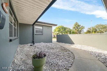 a view of a livingroom with wooden floor and a window