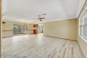 a view of a kitchen with a sink and cabinets