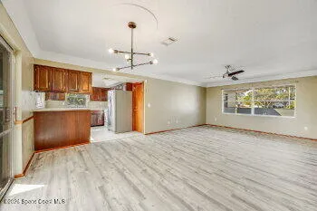 a kitchen with stainless steel appliances a refrigerator sink and cabinets