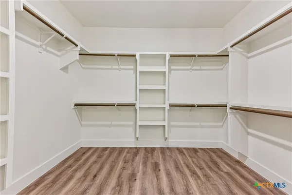 a view of an empty walk in closet