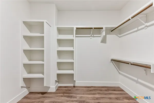 a view of an empty walk in closet