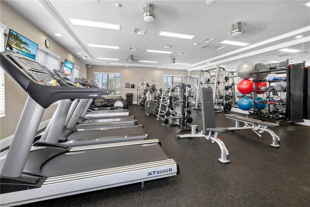 6529 Marbella Drive Naples, FL 34105 - Photo 26 of 29 a view of a room with gym equipment