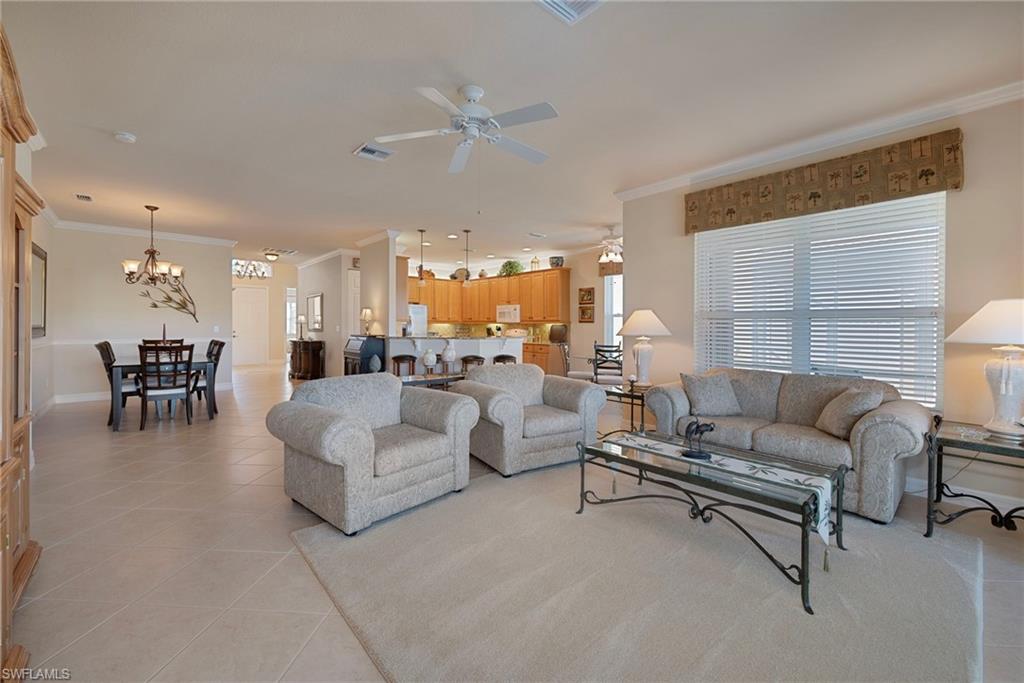 6529 Marbella Drive Naples, FL 34105 - Photo 29 of 29 a living room with furniture and a large window