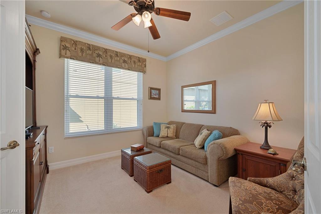6529 Marbella Drive Naples, FL 34105 - Photo 3 of 29 a living room with furniture and a window