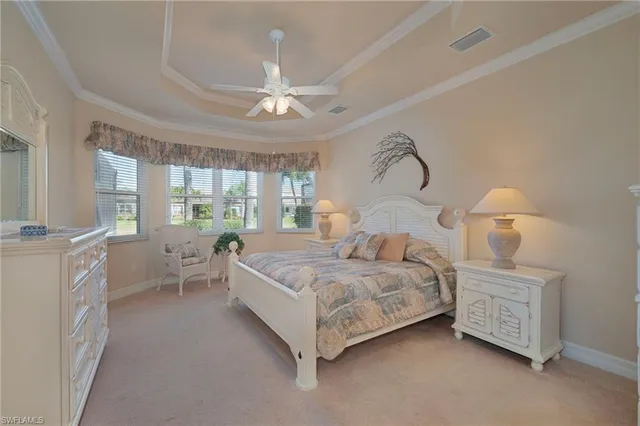 a dining room with furniture a chandelier and wooden floor