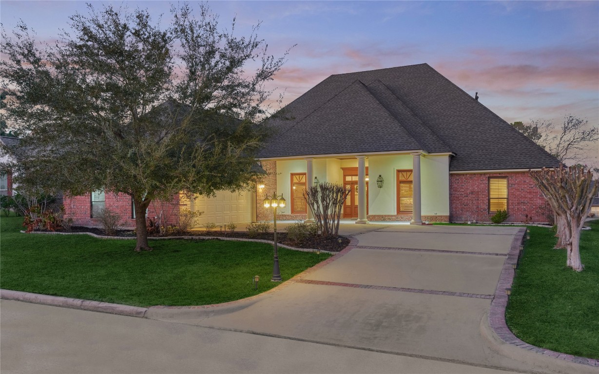 27 Bent Tree Lane Montgomery, TX 77356 - Photo 1 of 50 Welcome to this stunning 1.5-story custom home, highlighted by a brick-lined driveway, stately columns and new roof (2023).