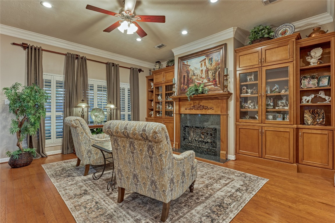 27 Bent Tree Lane Montgomery, TX 77356 - Photo 14 of 50 Formal living room with warm fireplace flanked by rich wood built-ins. This is the perfect area for book club or bunko!