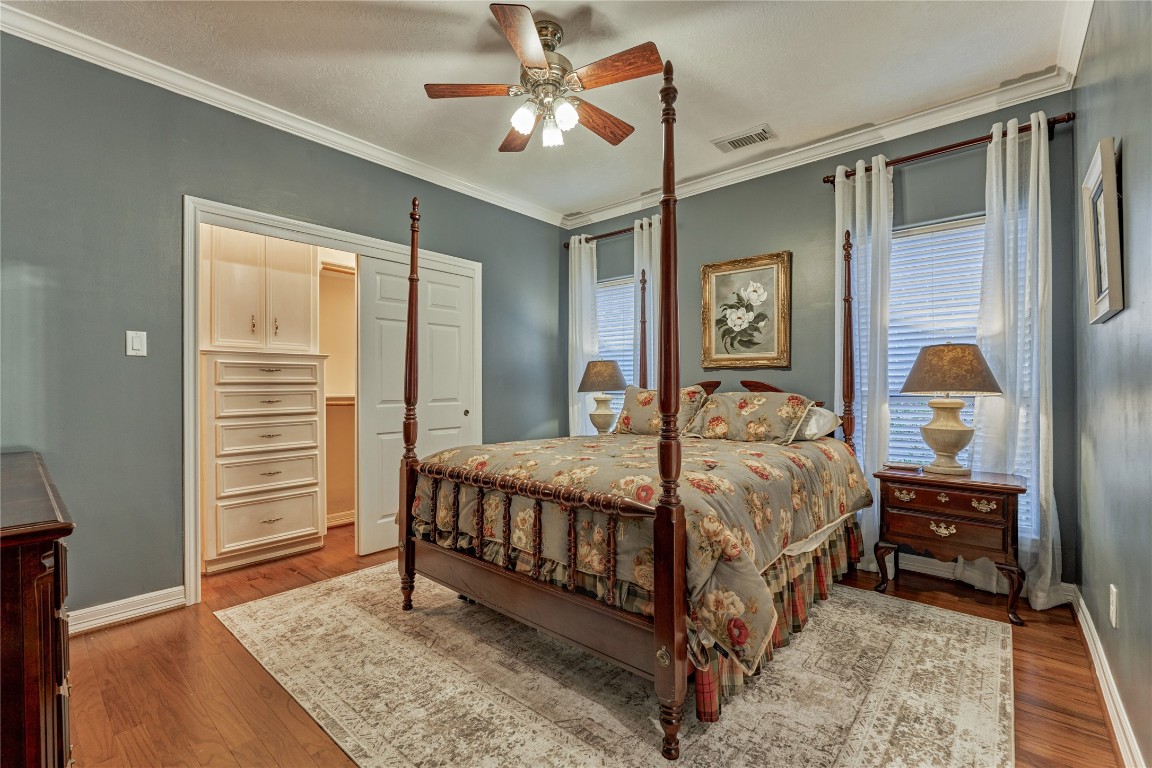 27 Bent Tree Lane Montgomery, TX 77356 - Photo 34 of 50 This beautiful bedroom enjoys wood flooring and a walk-in closet with built-ins.