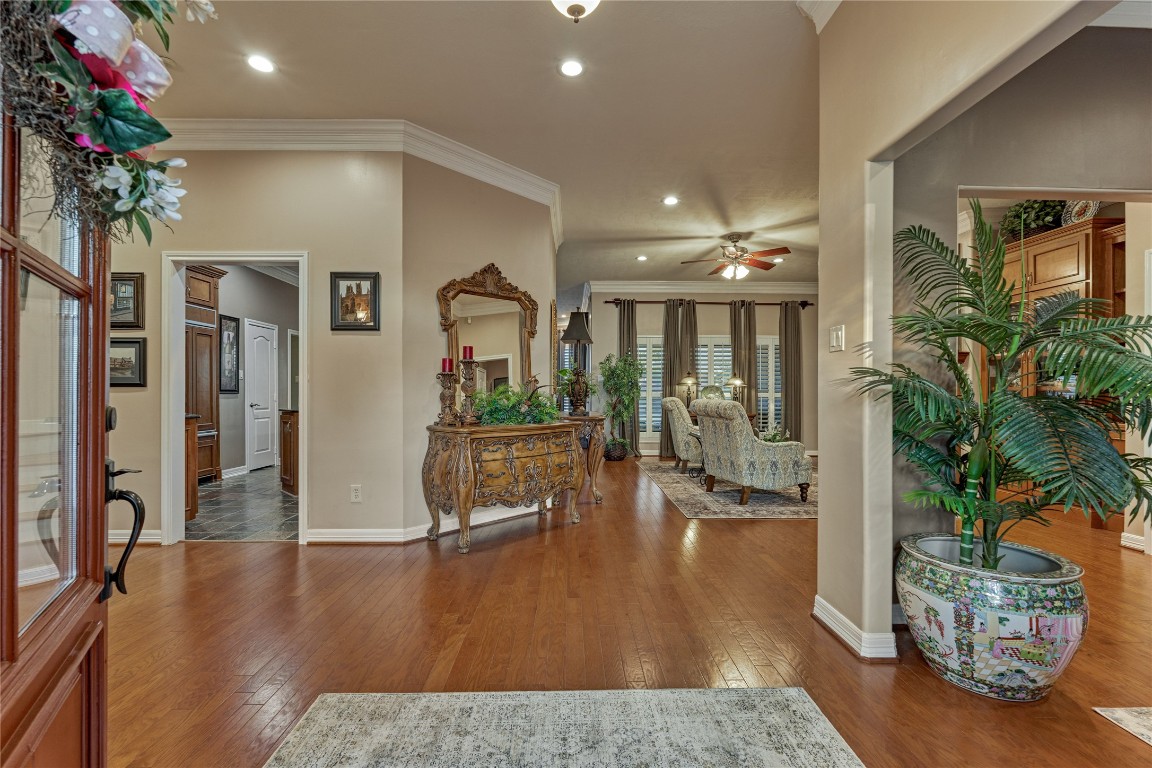 27 Bent Tree Lane Montgomery, TX 77356 - Photo 7 of 50 The foyer welcomes you with rich wood flooring, triple crown molding and tall ceilings.