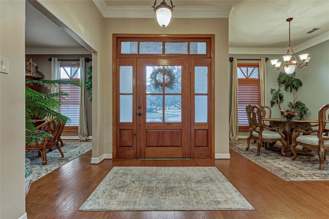 27 Bent Tree Lane Montgomery, TX 77356 - Photo 8 of 50 A beautiful wood front door, topped with a transom window, welcomes abundant natural light, creating an elegant entryway.