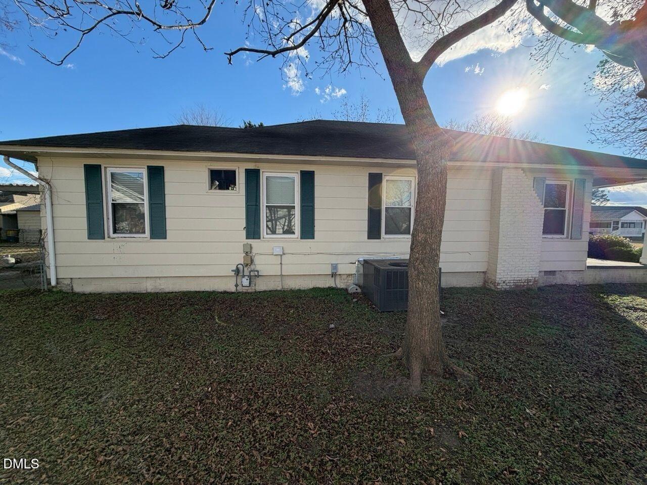 505 South 16th Street Erwin, NC 28339 - Photo 2 of 6 a front view of a house with garden