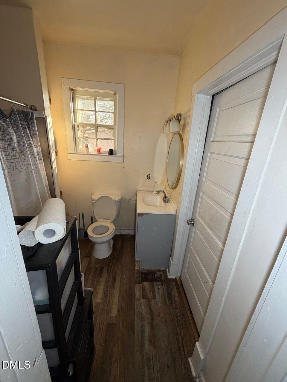505 South 16th Street Erwin, NC 28339 - Photo 5 of 6 a bathroom with a sink mirror toilet and bathtub
