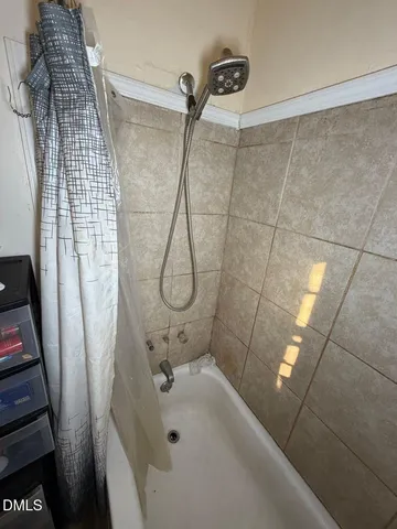 a bathroom with a sink and shower