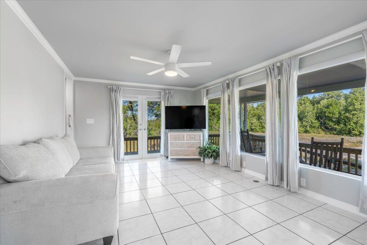 3167 Stewart Road Summerland Key, FL 33042 - Photo 4 of 33 a spacious bedroom with a large bed and a flat screen tv