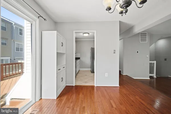 a view of livingroom with hardwood floor and a ceiling fan