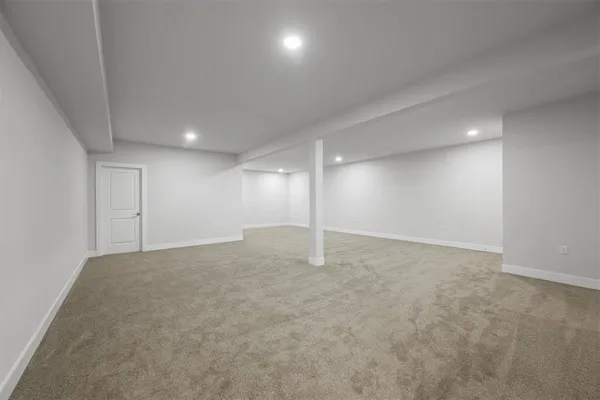 an empty room with a empty space and windows