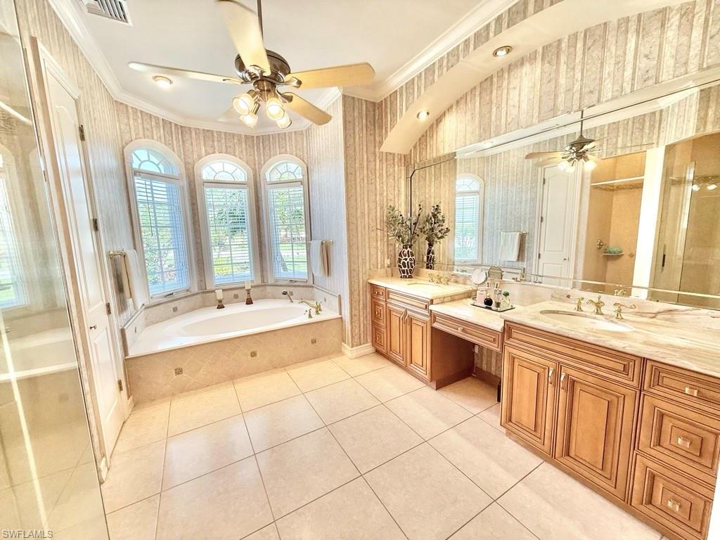 8064 Tiger Lily Drive Naples, FL 34113 - Photo 18 of 21 a large white kitchen with a large window