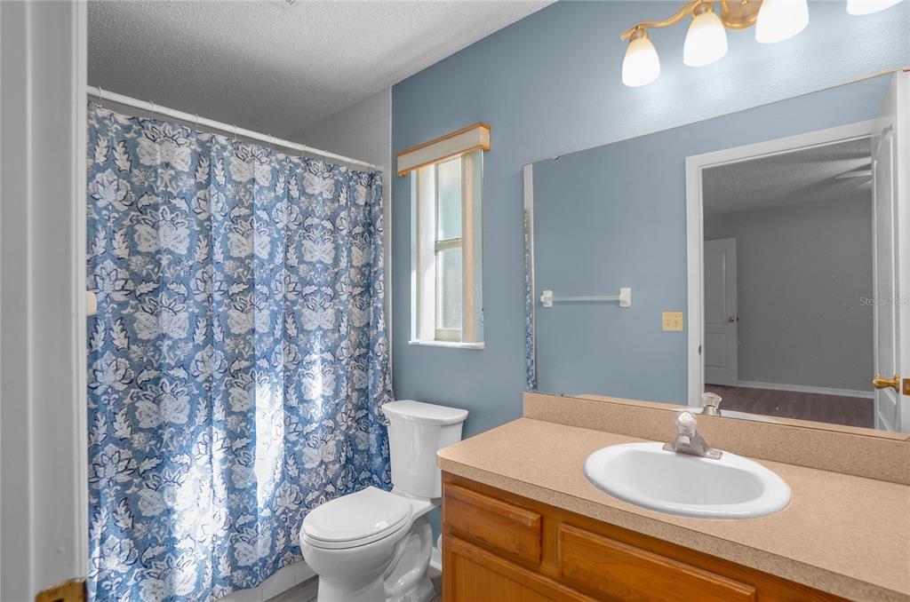 3926 East Bennett Street Inverness, FL 34453 - Photo 17 of 33 a bathroom with a sink toilet and a mirror