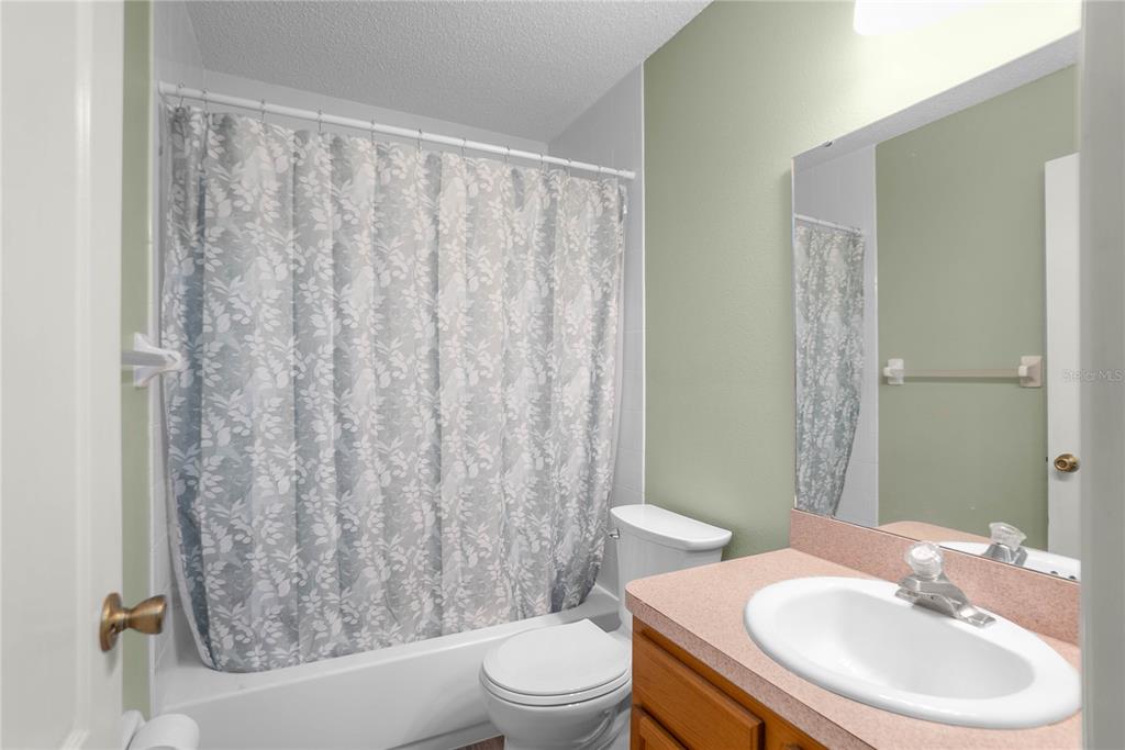 3926 East Bennett Street Inverness, FL 34453 - Photo 21 of 33 a bathroom with a sink toilet and shower