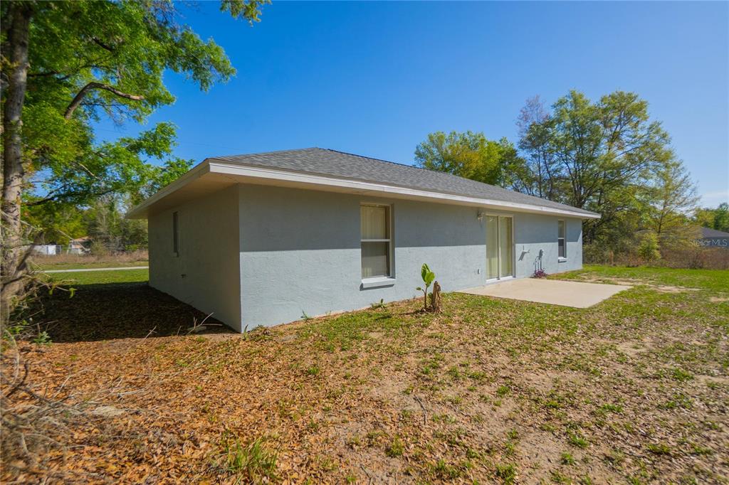 3926 East Bennett Street Inverness, FL 34453 - Photo 24 of 33 a front view of house with yard and trees