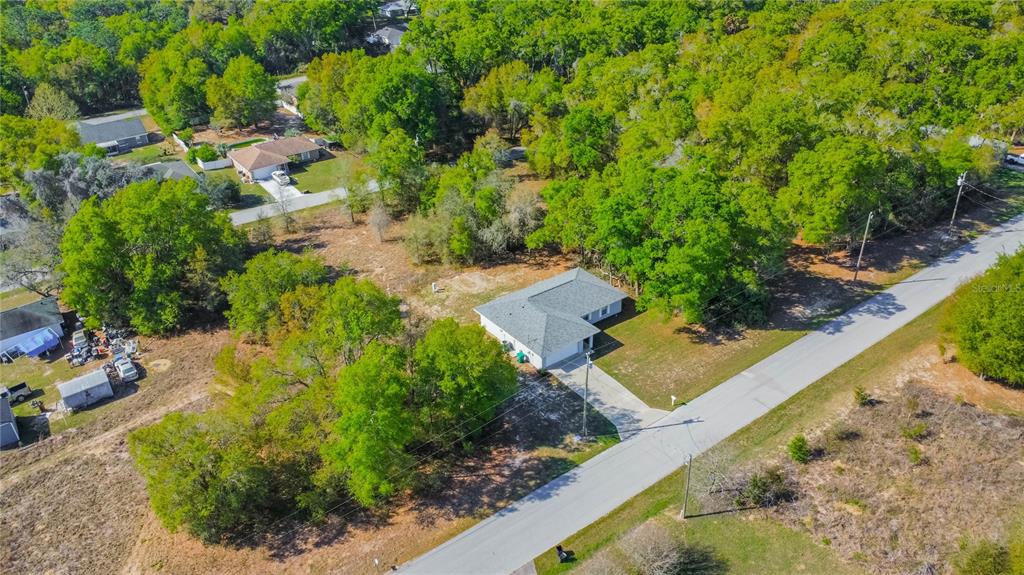 3926 East Bennett Street Inverness, FL 34453 - Photo 29 of 33 an aerial view of a house with a yard