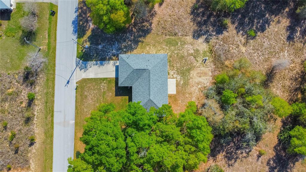 3926 East Bennett Street Inverness, FL 34453 - Photo 30 of 33 an aerial view of a residential houses with yard