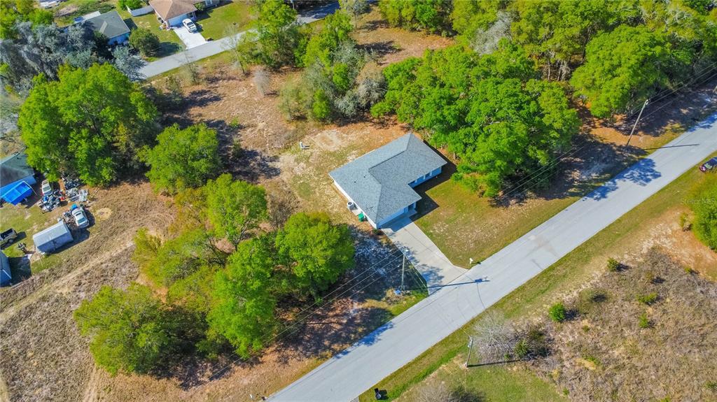 3926 East Bennett Street Inverness, FL 34453 - Photo 32 of 33 a view of a house with a yard