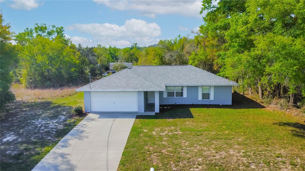 3926 East Bennett Street Inverness, FL 34453 - Photo 6 of 33 a house view with a garden space