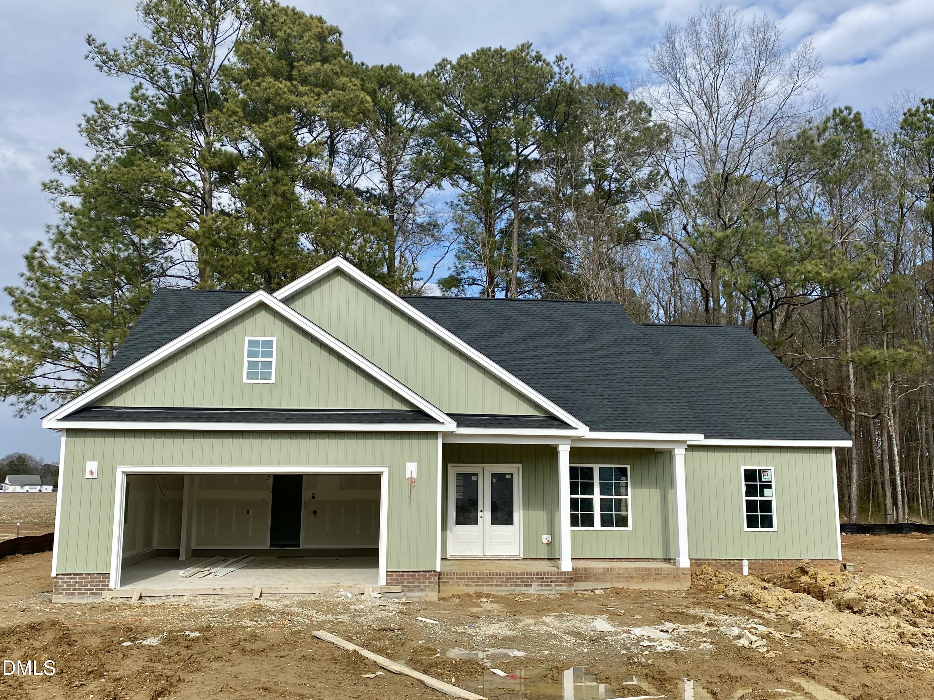 a front view of a house with a garage
