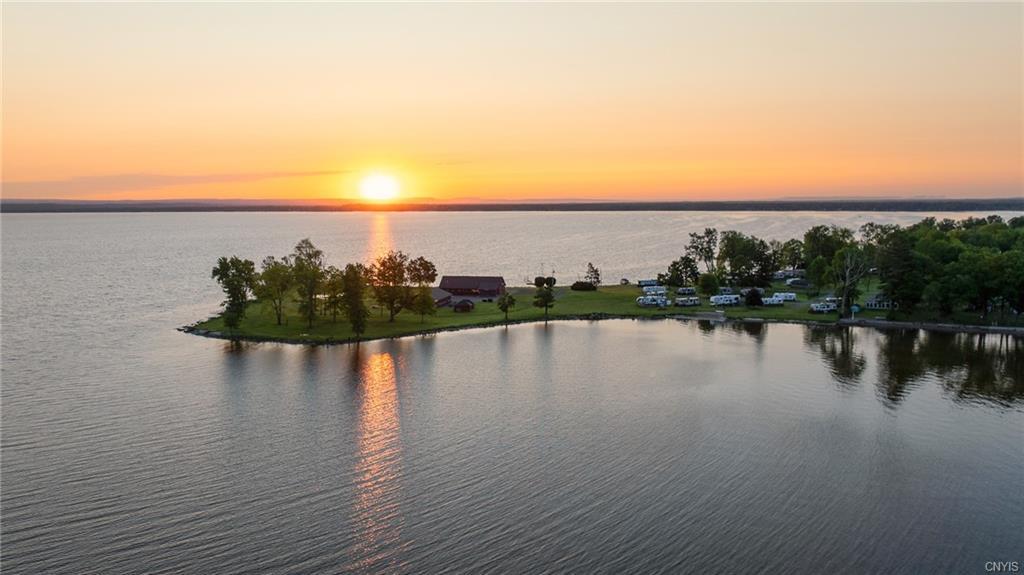 a view of a lake with houses in the back