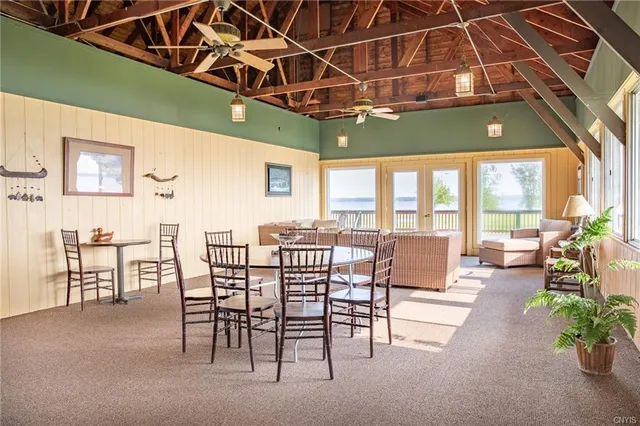 a outdoor space with patio lots of furniture and black umbrella