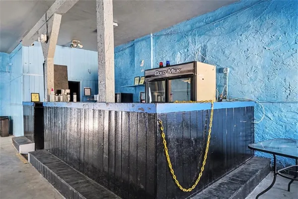 an entryway with wooden floor