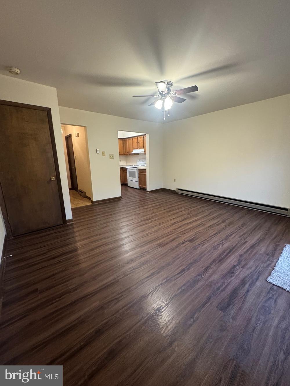742 Newport Avenue Gap, PA 17527 - Photo 3 of 9 a view of a livingroom with hardwood floor and a ceiling fan