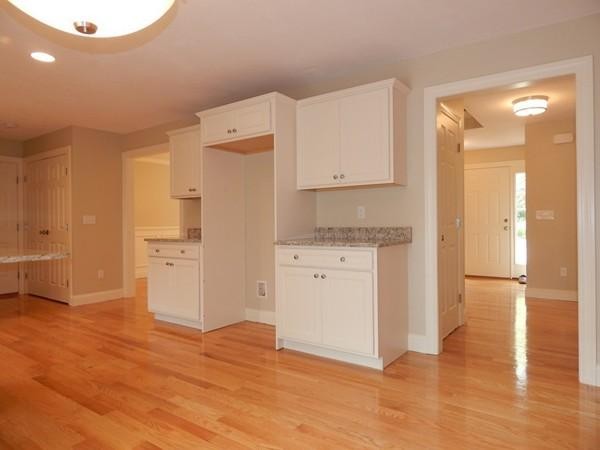 342 Spring Street Wrentham, MA 02093 - Photo 6 of 30 a kitchen with granite countertop a refrigerator and a stove
