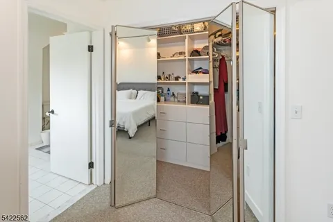 a bathroom with a double vanity sink mirror and shower