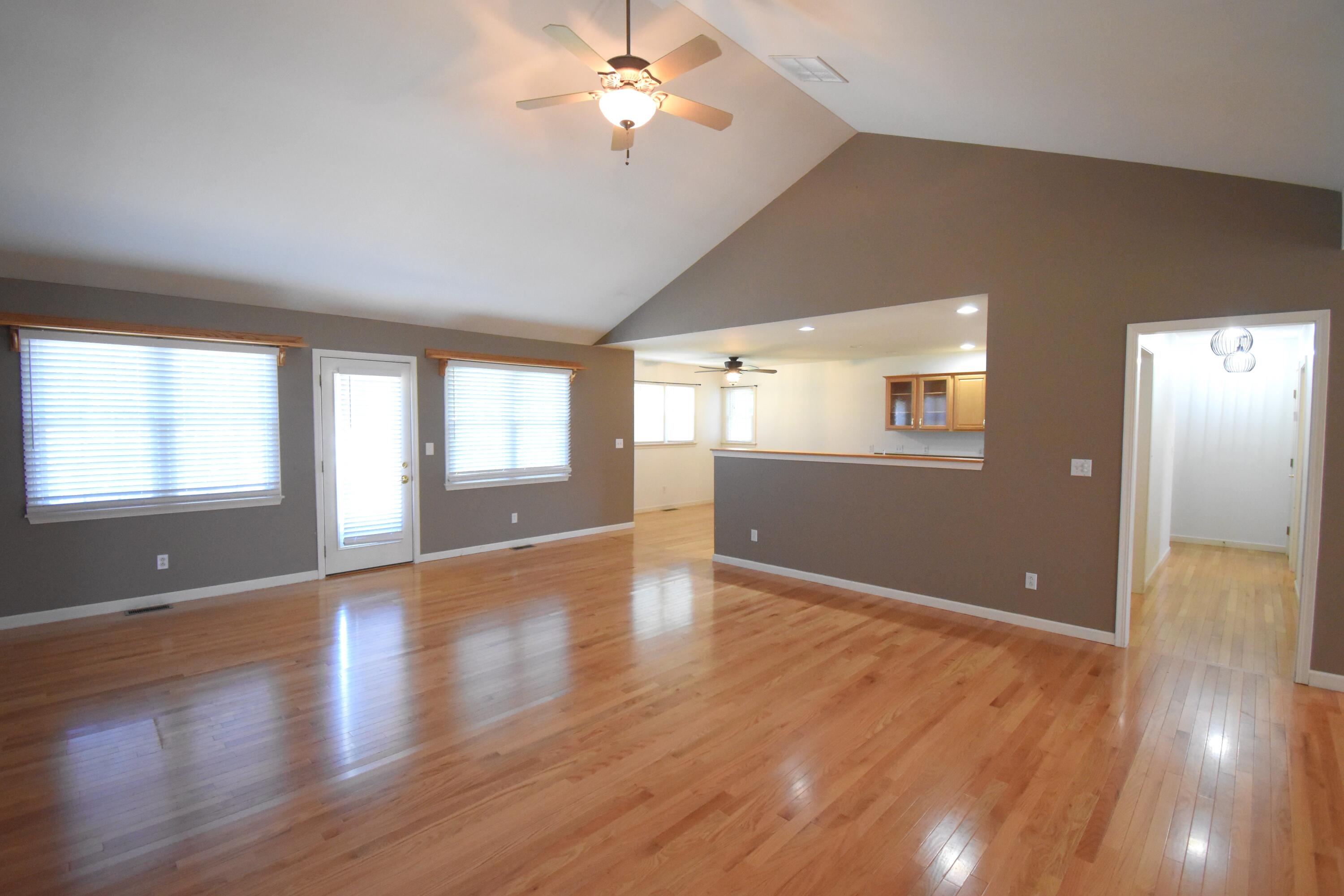522 Pheasant Run Rensselaer, IN 47978 - Photo 20 of 55 a view of an empty room with window and wooden floor