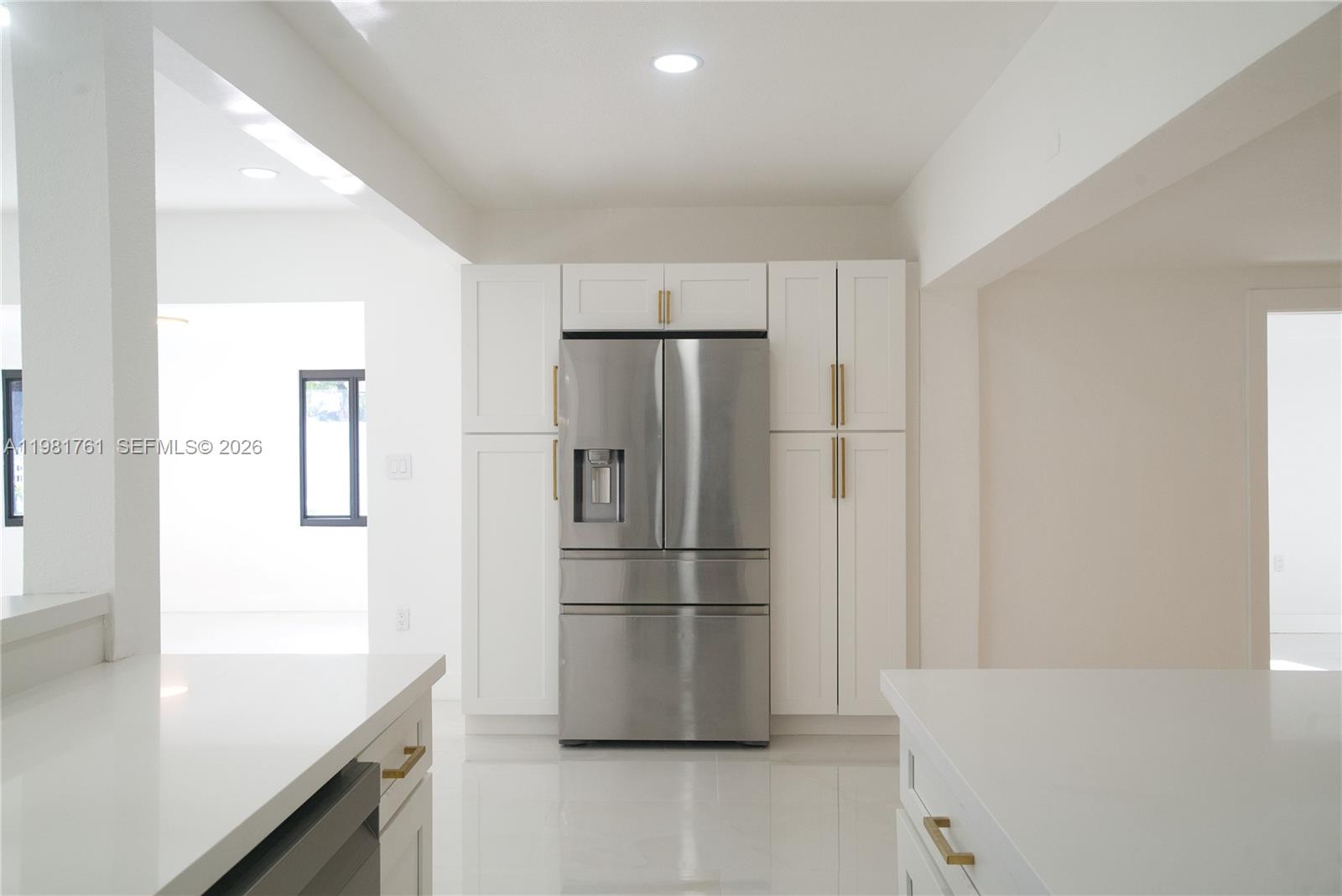 315 Northwest 127th Street North Miami, FL 33168 - Photo 18 of 67 a kitchen with stainless steel appliances a refrigerator and a sink
