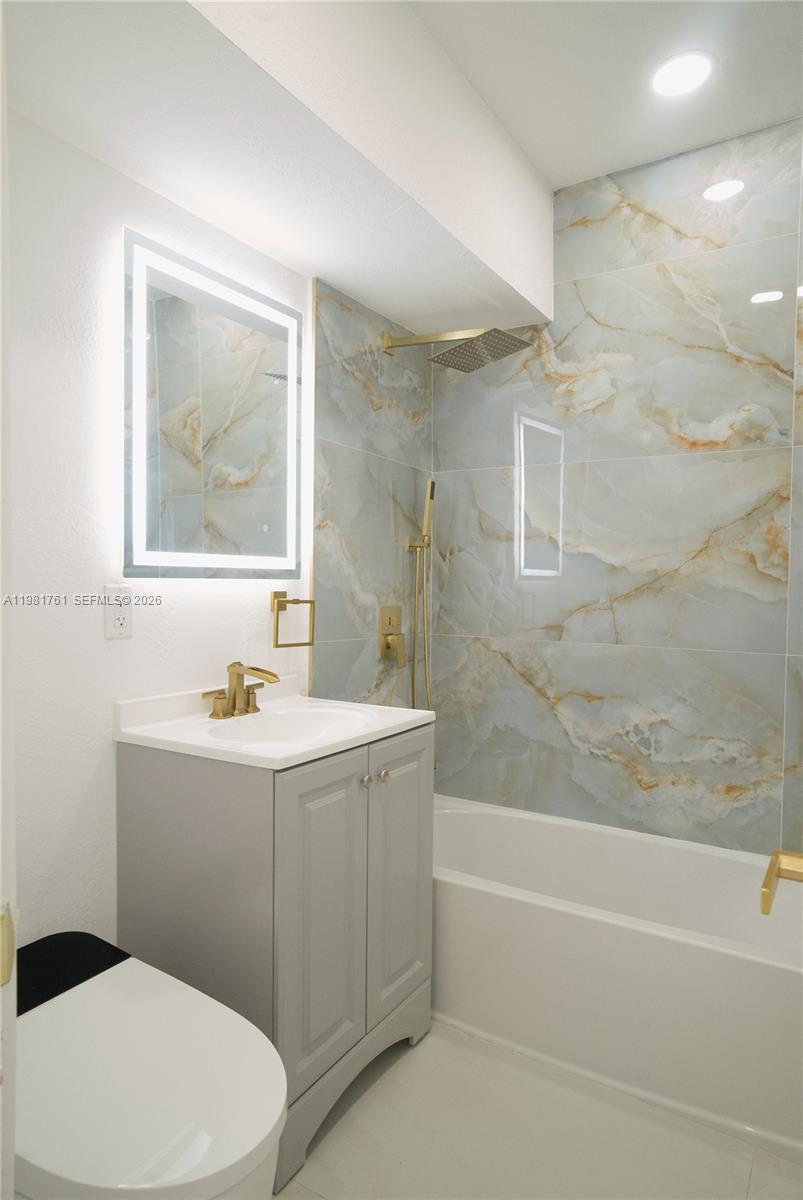 315 Northwest 127th Street North Miami, FL 33168 - Photo 27 of 67 a bathroom with a sink a toilet and shower